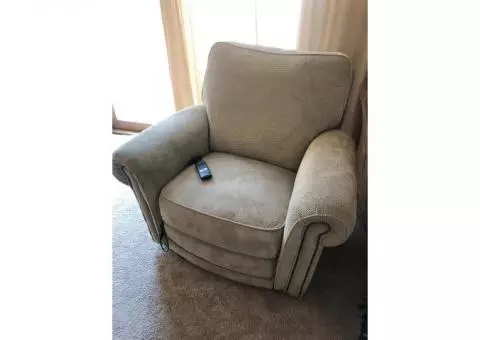 Loveseat and chair with powered foot rest